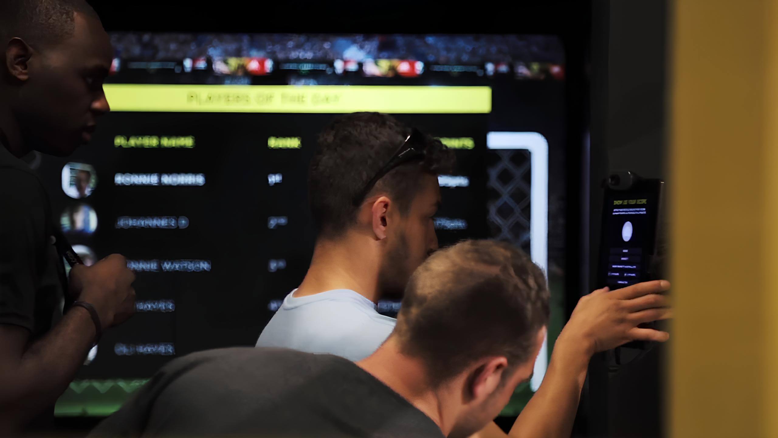 Players signing up on the tablet before starting the game.